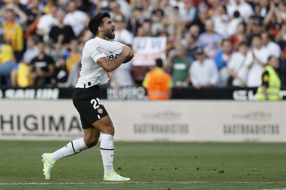 Эрай Комерт